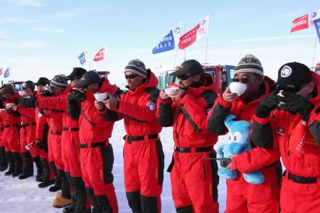 Some members of China's expedition team drink before their journey in Zhongshan station, Antarctica, December 18, 2009.