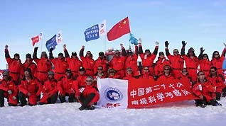 Some members of China's expedition team pose for the photo before their journey in Zhongshan station, Antarctica, December 18, 2009. China's expedition team sent two teams to the inland of Antarctica on Friday. One team headed to China's Kunlun Station, the other one went to the Grove Mountains.