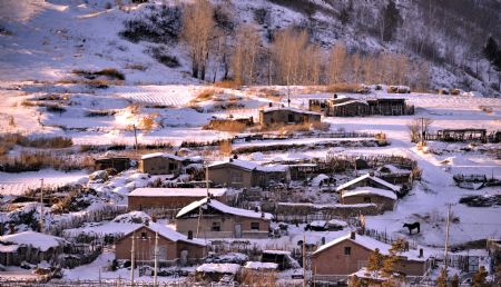 The picture taken on December 19, 2009 shows a village covered by snow in north China's Inner Mongolia Autonomous Region. A cold snap coming from Siberia swept easter part of Inner Mongolia on Friday and Saturday. The cold snap brought sharp drop of temperatures in the autonomous region where the lowest temperatures fell to about minus 30 degrees Celsius.