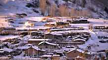 The picture taken on December 19, 2009 shows a village covered by snow in north China's Inner Mongolia Autonomous Region. A cold snap coming from Siberia swept easter part of Inner Mongolia on Friday and Saturday. The cold snap brought sharp drop of temperatures in the autonomous region where the lowest temperatures fell to about minus 30 degrees Celsius.