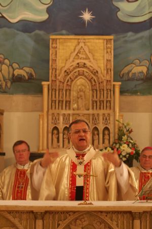 Latin Patriarch Fuad Twal heads a mass at the Latin Church in the West Bank city of Beit Sahour near Bethlehem on December 19, 2009. 