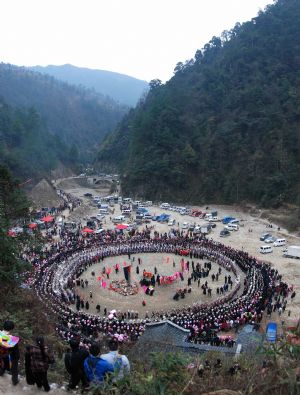 People of the Miao ethnic group perform traditional dance during the closing celebration of the Guzang Festival at Wuliu Village in Leishan County, southwest China&apos;s Guizhou Province, December 19, 2009. 