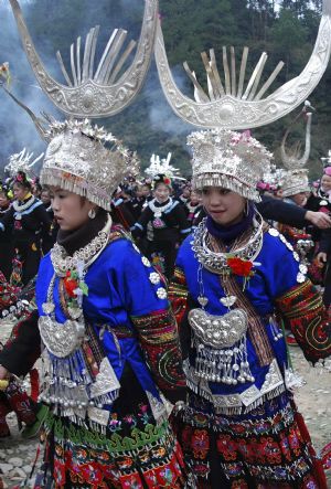 People of the Miao ethnic group perform traditional dance during the closing celebration of the Guzang Festival at Wuliu Village in Leishan County, southwest China&apos;s Guizhou Province, December 19, 2009.