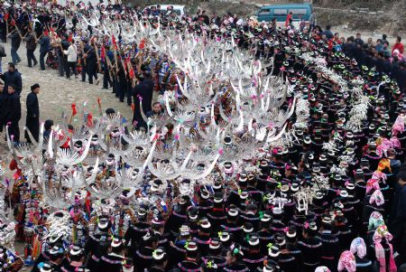 People of the Miao ethnic group perform traditional dance during the closing celebration of the Guzang Festival at Wuliu Village in Leishan County, southwest China&apos;s Guizhou Province, December 19, 2009. 