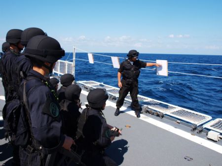 Chinese navy soldiers participate in a training on Ma'anshan frigate of the fourth Chinese naval flotilla in the Gulf of Aden, December 16, 2009. 