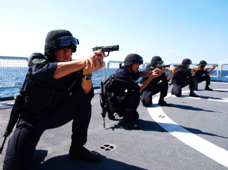 Chinese navy soldiers participate in a training on Ma'anshan frigate of the fourth Chinese naval flotilla in the Gulf of Aden, December 16, 2009.