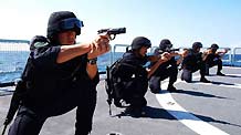 Chinese navy soldiers participate in a training on Ma'anshan frigate of the fourth Chinese naval flotilla in the Gulf of Aden, December 16, 2009.