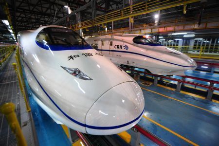 Two high-speed trains stop at the high-speed railway maintenance base in Wuhan, capital of central China&apos;s Hubei Province, December 22, 2009.