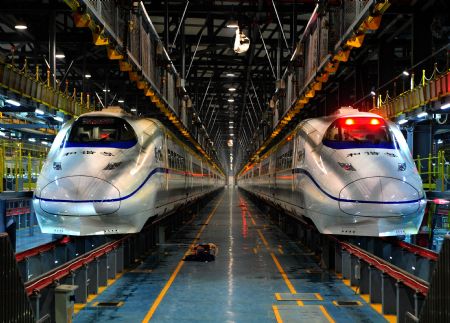 Two high-speed trains stop at the high-speed railway maintenance base in Wuhan, capital of central China&apos;s Hubei Province, December 22, 2009. 