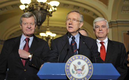 US Senate majority leader Harry Reid (C) speaks during a news conference in Washington December 24, 2009. 