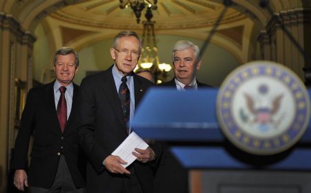 US Senate majority leader Harry Reid (C) prepares to address a news conference in Washington December 24, 2009. 