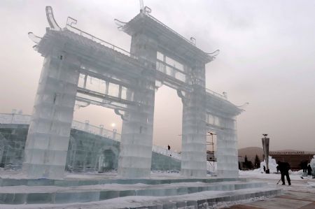 Technicians from Harbin, northeast China's Heilongjiang Province, work on an ice sculpture in Hexigten Qi in north China's Inner Mongolia Autonomous Region, December 25, 2009. 