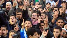 Hamas supporters attend a demonstration to protest an underground barrier Egypt is building, during a rally in Gaza City December 25, 2009. The assumed wall would curb a network of underground tunnels the Palestinians use to bring in a wide variety of goods and products that Israel does not allow into the Gaza Strip due to the closure of the commercial crossings with Israel.