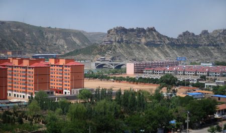 Residential areas are seen in this file photo taken on May. 25, 2009 in Shenmu County, northwest China's Shaanxi Province. 