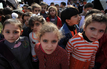 Palestinian students take part in a rally in protest against Israel&apos;s war on Gaza Strip on December 27, 2008, the one-year anniversary of the start of Israel&apos;s war on Gaza Strip, in Gaza City on December 27, 2009.