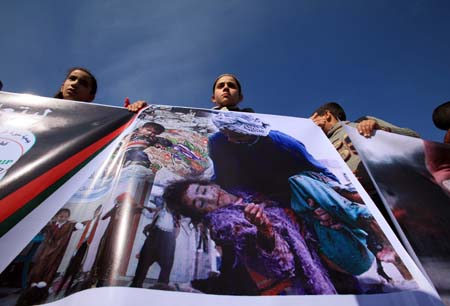 Palestinian students take part in a rally in protest against Israel&apos;s war on Gaza Strip on December 27, 2008, the one-year anniversary of the start of Israel&apos;s war on Gaza Strip, in Gaza City on December 27, 2009. 