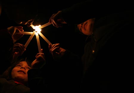 Palestinian children take part in a candle-lighting protest in solidarity with Gaza, in the West Bank city of Ramallah, on December 27, 2009. 