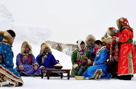 A traditional Ujimqin wedding ceremony is presented for tourists in Xi Ujimqin Qi, north China's Inner Mongolia Autonomous Region, on December 28, 2009.