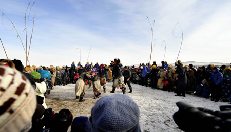 Men of Mongolian ethnic group wrestle in Xi Ujimqin Qi, north China's Inner Mongolia Autonomous Region, on December 28, 2009.