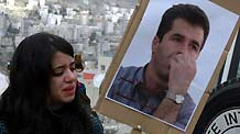 Palestinian woman takes part in a protest, calling for the release of Palestinian prisoners from Israeli jails in the West Bank city of Nablus, December 28, 2009.