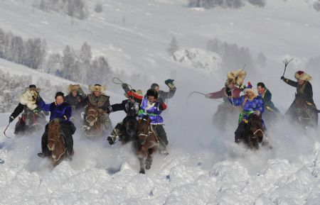 Local herdsmen compete at the horse race at Hom Kanas Town of Burqin County, northwest China's Xinjiang Uygur Autonomous Region, January 2, 2010.