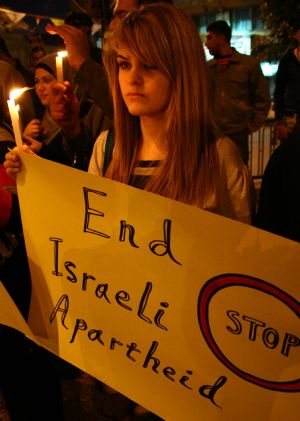 Palestinians attend a rally marking the one-year anniversary of Israeli offensive on the Gaza Strip, in the West Bank city of Nablus, on January 2, 2010.