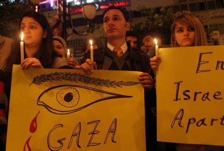 Palestinians attend a rally marking the one-year anniversary of Israeli offensive on the Gaza Strip, in the West Bank city of Nablus, on January 2, 2010.