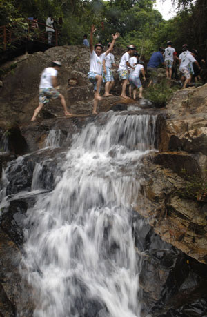 Tourists are seen at a scenic area in Hainan Province on December, 2009. 