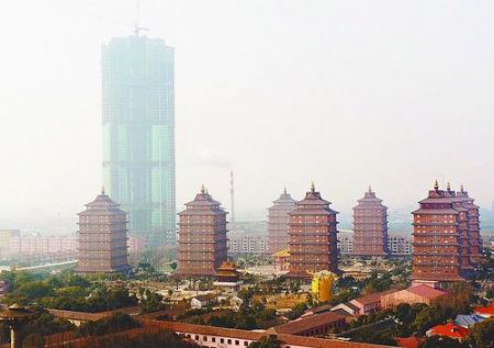 The new skyscraper being constructed in Huaxi Village, east China's Jiangsu Province, exceeds 250 meters in height on Tuesday, January 5, 2010. It is scheduled to be completed this June. 