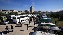 International peace activists stand next 153 trucks carrying medical supplies in Gaza, January 7, 2010.