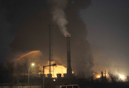 Picture taken on January 7, 2010 shows smoke and fire billowing from a factory in which an explosion occured in Lanzhou, capital of northwest China's Gansu Province. 