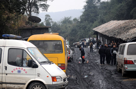 Police officers keep order at Miaoshang Coal Mine in Yushui District of Xinyu City, east China's Jiangxi Province, January 9, 2010.