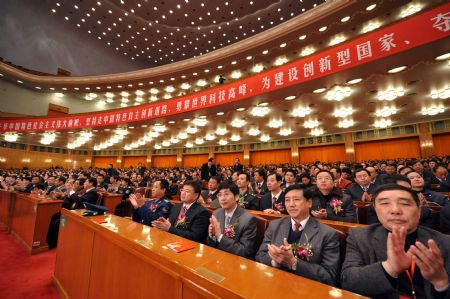 Attendees applaud during China's State Top Scientific and Technological Award ceremony at the Great Hall of the People in Beijing, capital of China, on January 11, 2010.