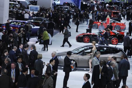 People visit the 2010 North American International Auto Show (NAIAS) during the media preview of the show at Cobo center in Detroit, Michigan, the United States, January 11, 2010. 