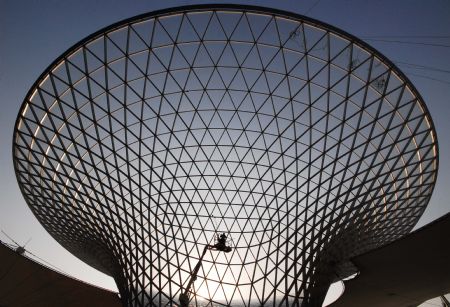 Photo taken on January 12, 2010 shows a worker cleaning the glass curtain of the Sunshine Valley located at the axle of the World Expo Garden in Shanghai, east China. 