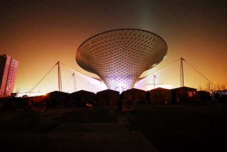 Photo taken on January 12, 2010 shows the scenery of the Expo Axis during a trial illumination in the Expo Park in Shanghai, east China. 