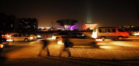 Photo taken on January 12, 2010 shows the scenery of the Expo Axis during a trial illumination in the Expo Park in Shanghai, east China. 