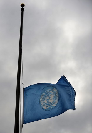 United Nations flag flies at half mast to mourn the victims of the Haiti earthquake in front of the UN headquarters in New York, January 13, 2010. 