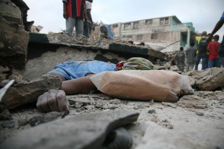 A person is buried under debris after a devastating earthquake jolted Haiti's capital Port-au-Prince on January 12, 2010.