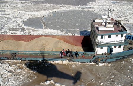 The video grab taken on January 13, 2010 shows a helicopter from Chinese North Sea relief flight team arrives at the location where a ship with 6 crews was trapped by sea ice off the coast of Binzhou City of east China's Shandong Province. The 6 crewmen were rescued safely on Wednesday.