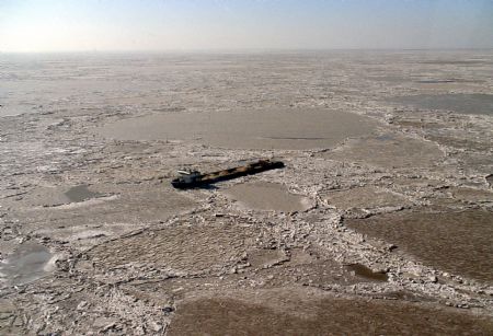 The video grab taken on January 13, 2010 shows a ship is trapped by sea ice off the coast of Binzhou City of east China's Shandong Province. 