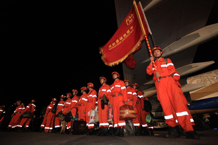 A Chinese rescue team arrive at the airport in Haitian capital Port-au-Prince on January 14, 2009.