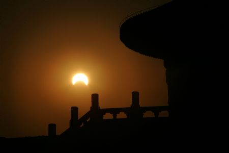 A partial eclipse is seen in this photo taken at the Temple of Heaven in Beijing, capital of China, Jan. 15, 2010. (Xinhua/Zheng Huansong)