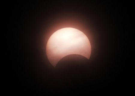 The solar eclipse is seen in Qingdao of east China&apos;s Shandong Province, Jan. 15, 2010. The annular eclipse occurred over the sky in Qingdao Friday.