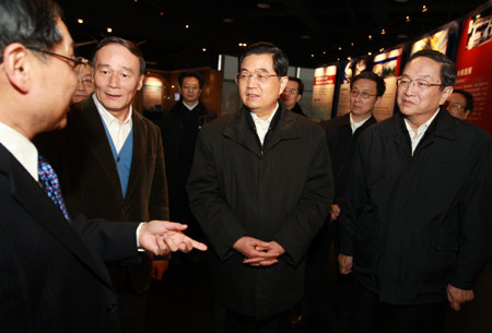Hu Jintao (C), general secretary of the Central Committee of the Communist Party of China, Chinese president and chairman of the Central Military Commission, inspects the heavy equipment manufacturing base of Shanghai Electric Group Co., Ltd. ,in Shanghai, east China, on January 15, 2010. 