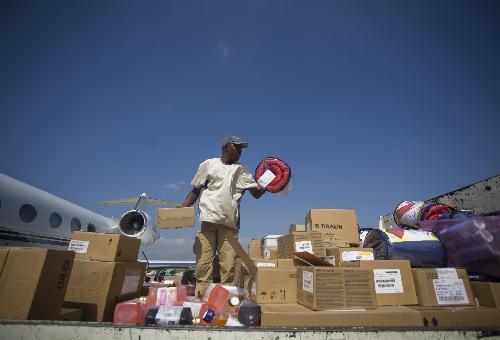 People transport relief goods in Port-au-Prince, Haiti, on January 17, 2009.