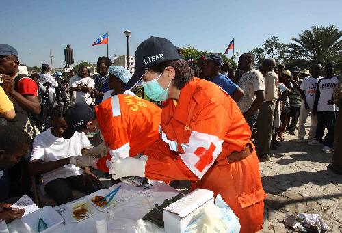 Medical workers of China International Search and Rescue Team (CISAR) treat the earthquake survivors in Port-au-Prince, Haiti, January 18, 2010.