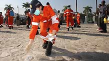 A medical worker of China International Search and Rescue Team (CISAR) clean up for a medical ground in Port-au-Prince, Haiti, January 18, 2010.