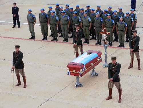 A mourning ceremony is held for Argentina's UN peace-keeping soldier Gustavo Gomez, killed in the huge quake measuring 7.3 on the Richter scale that rocked Haiti on January 12, at the airport in Buenos Aires, capital of Argentina, January 18, 2010. 