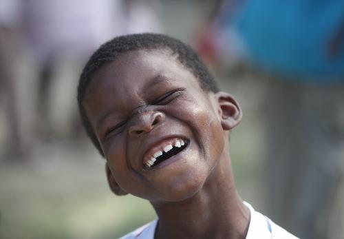 A child plays in an orphanage in Port-au-Prince, capital of Haiti, January 2010. Fifty children and six workers lived in a temporary shelter with few food and tents after the orphanage building was devastated in the strong earthquake on January 12.